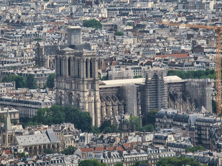 A detailed aerial view of Notre-Dame Cathedral during renovation in Paris, France.