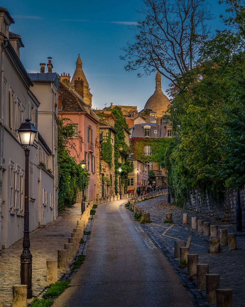 Explore a picturesque evening street in Montmartre, Paris, surrounded by historic architecture.
Montmartre Tours