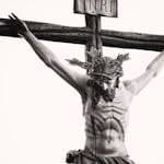 Monochrome depiction of Jesus crucified, showcasing religious artistry and sacrifice.